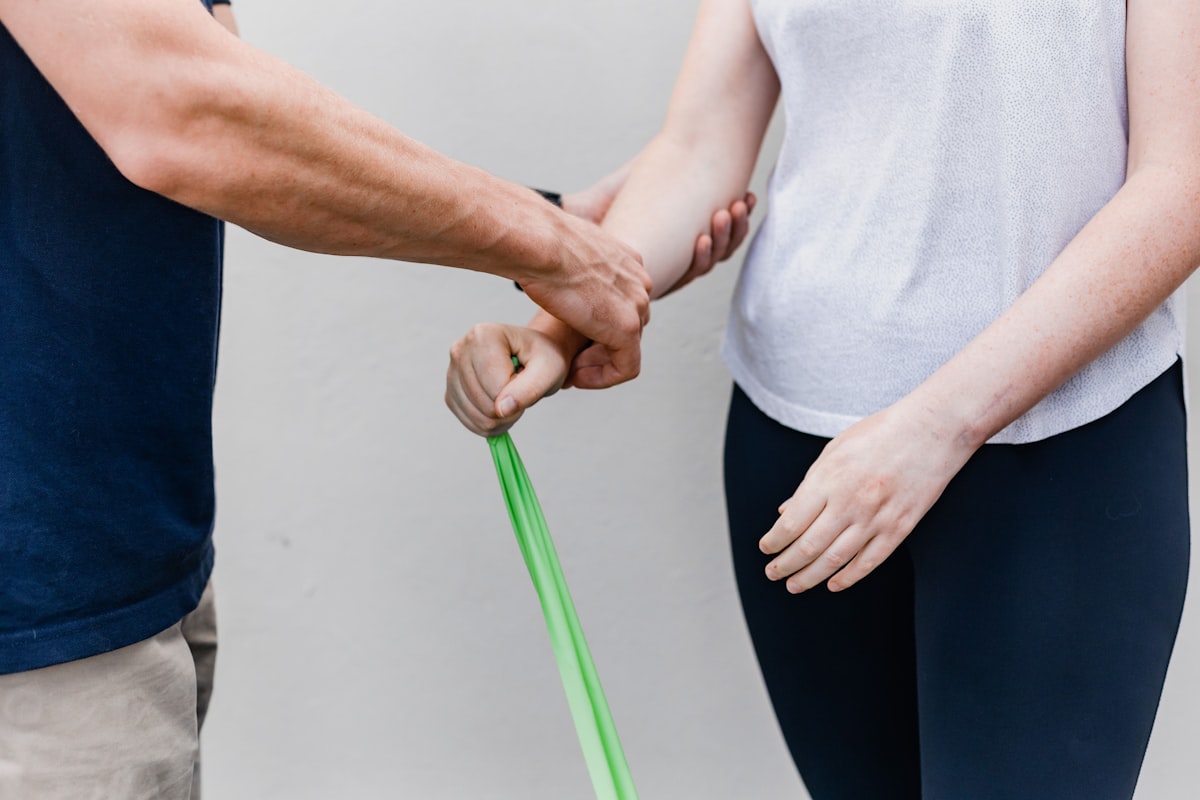 Instructor leading a kinesiotherapy class with participants